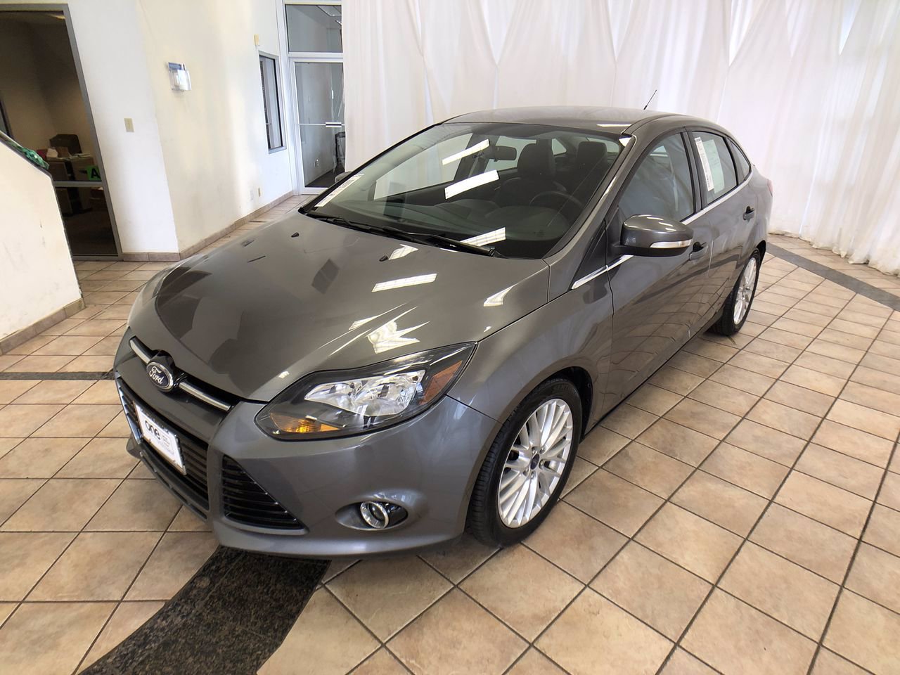 Pre-Owned 2014 Ford Focus Titanium FWD 4dr Car